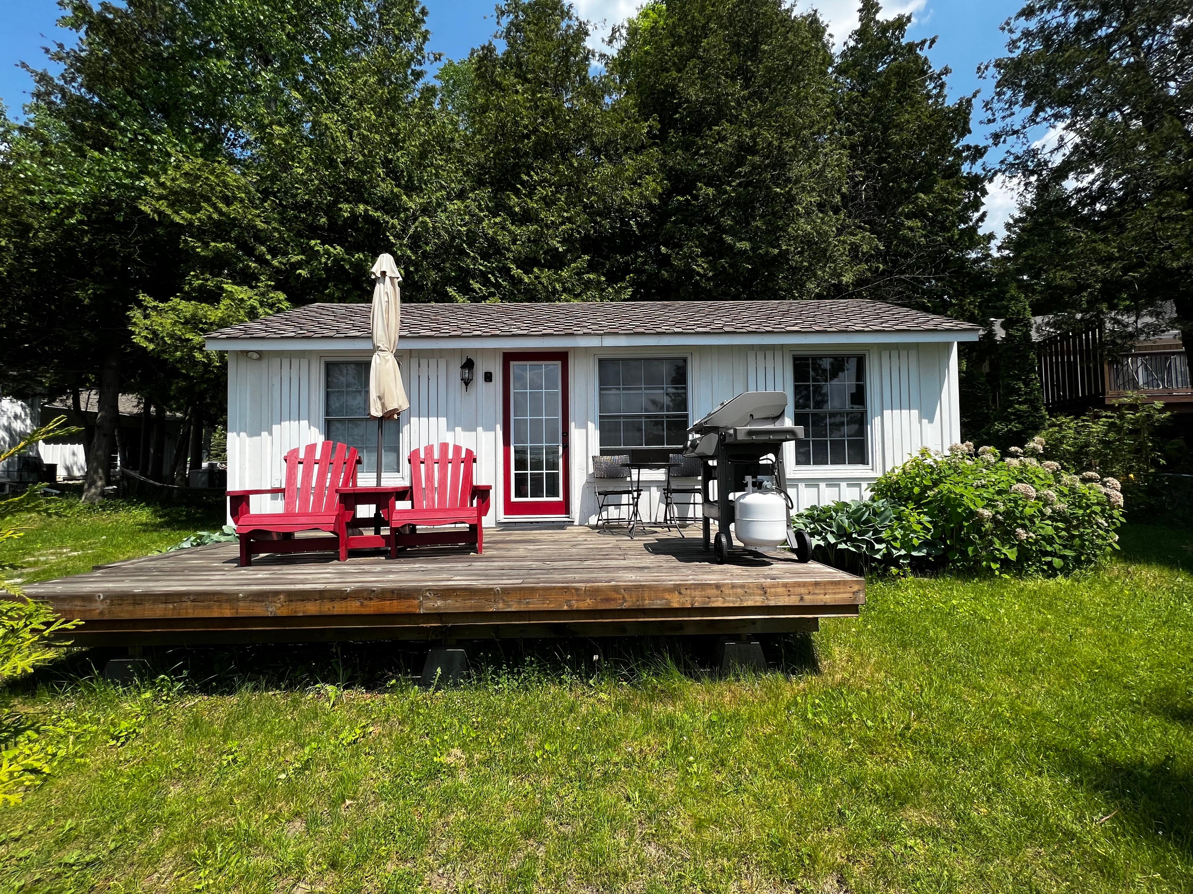 Lake Viewtopia cottage deck with red chairs